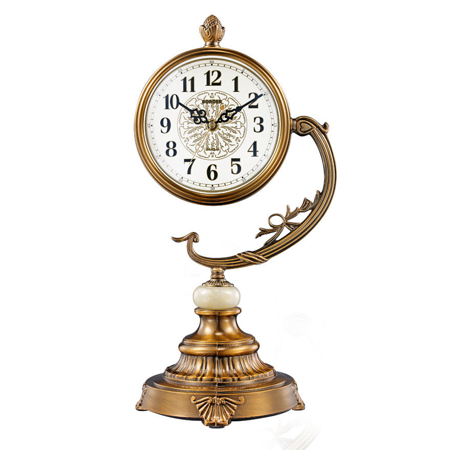 Decorative clock with gold and white design on a white background